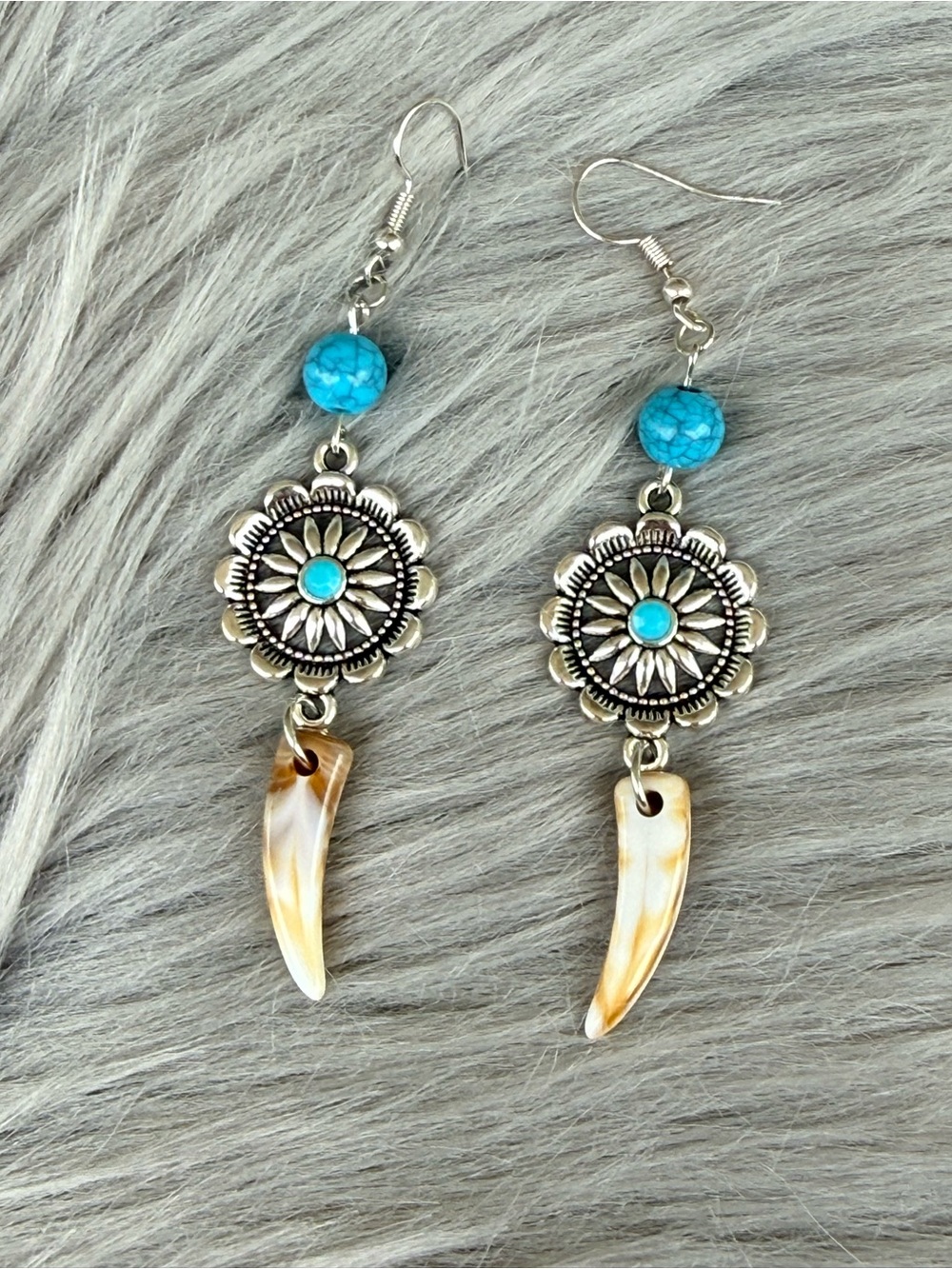 Lainey Wilson inspired western turquoise concho coyote teeth dangle earrings.